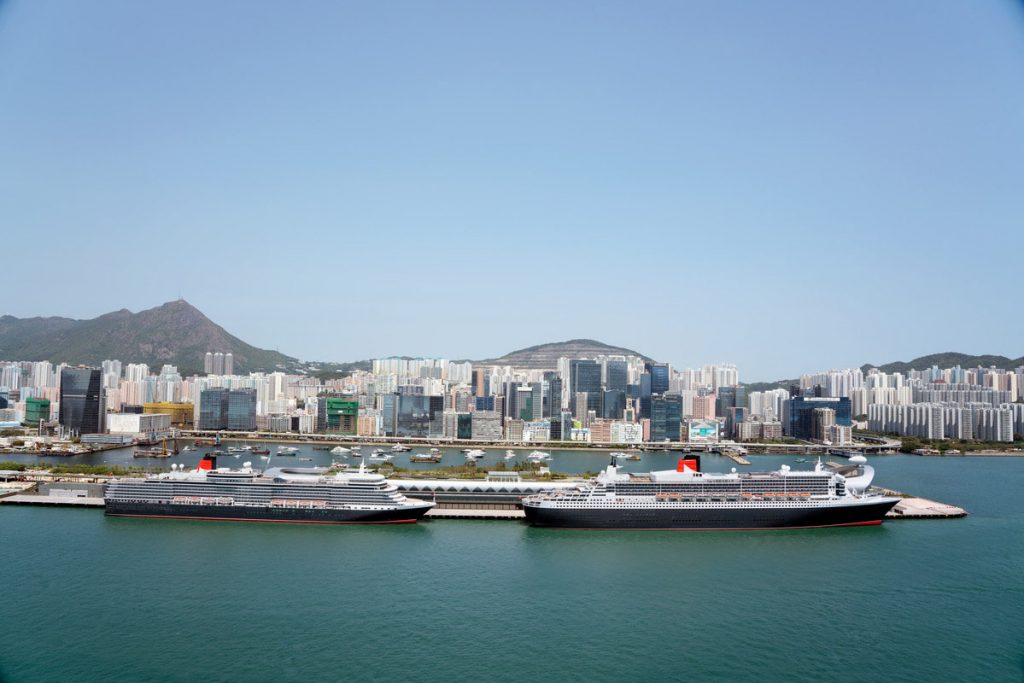 Queen Mary 2 and Queen Elizabeth docked in Victoria Harbour, Hong Kong